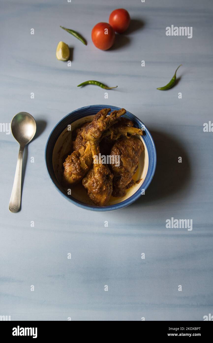 Kerala style chicken masala curry in a bowl. View from top. Stock Photo