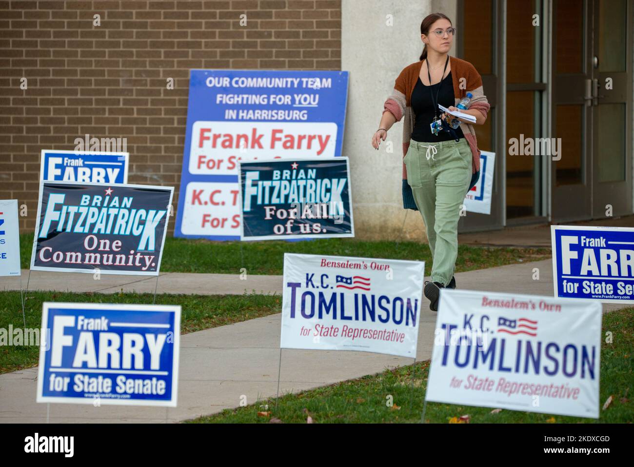 Bensalem, United States. 08th Nov, 2022. A woman passes campaign signs