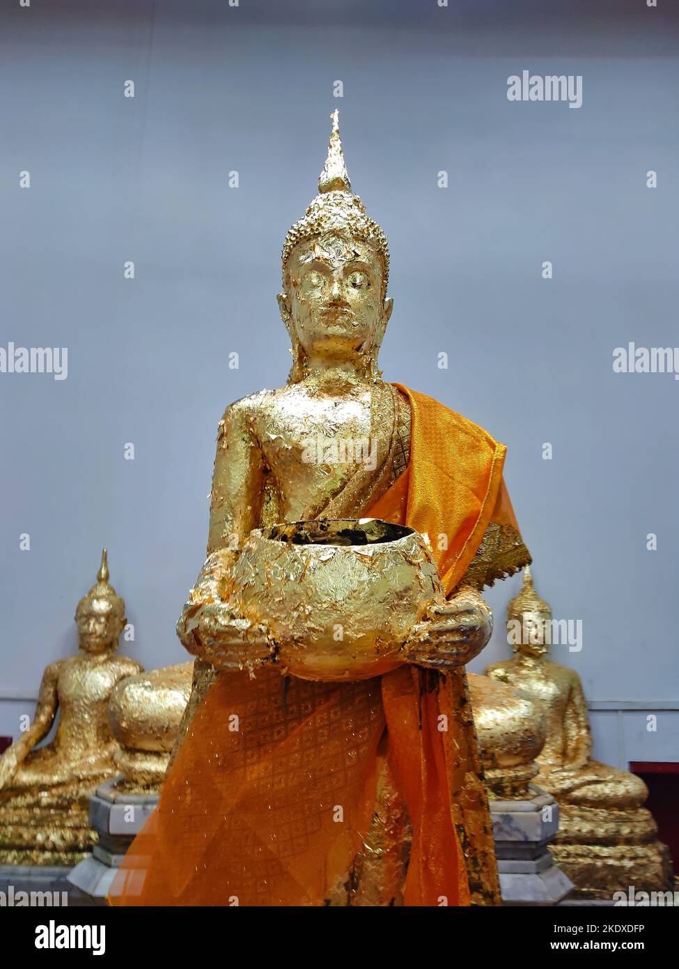 Buddha standing holding an alms bowl in Samut Songkhram province Stock Photo