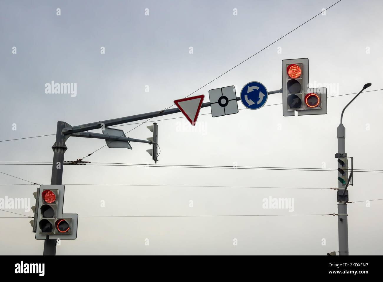 Red traffic light on gray sky background close up Stock Photo - Alamy