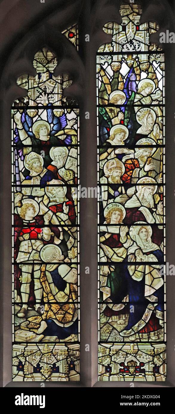 Detail of a stained glass window by Percy Bacon depicting a host of saints, St Peter's Church, Caversham, Berkshire Stock Photo