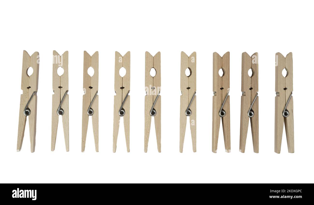 a row of wooden clothespins on a transparent background Stock Photo