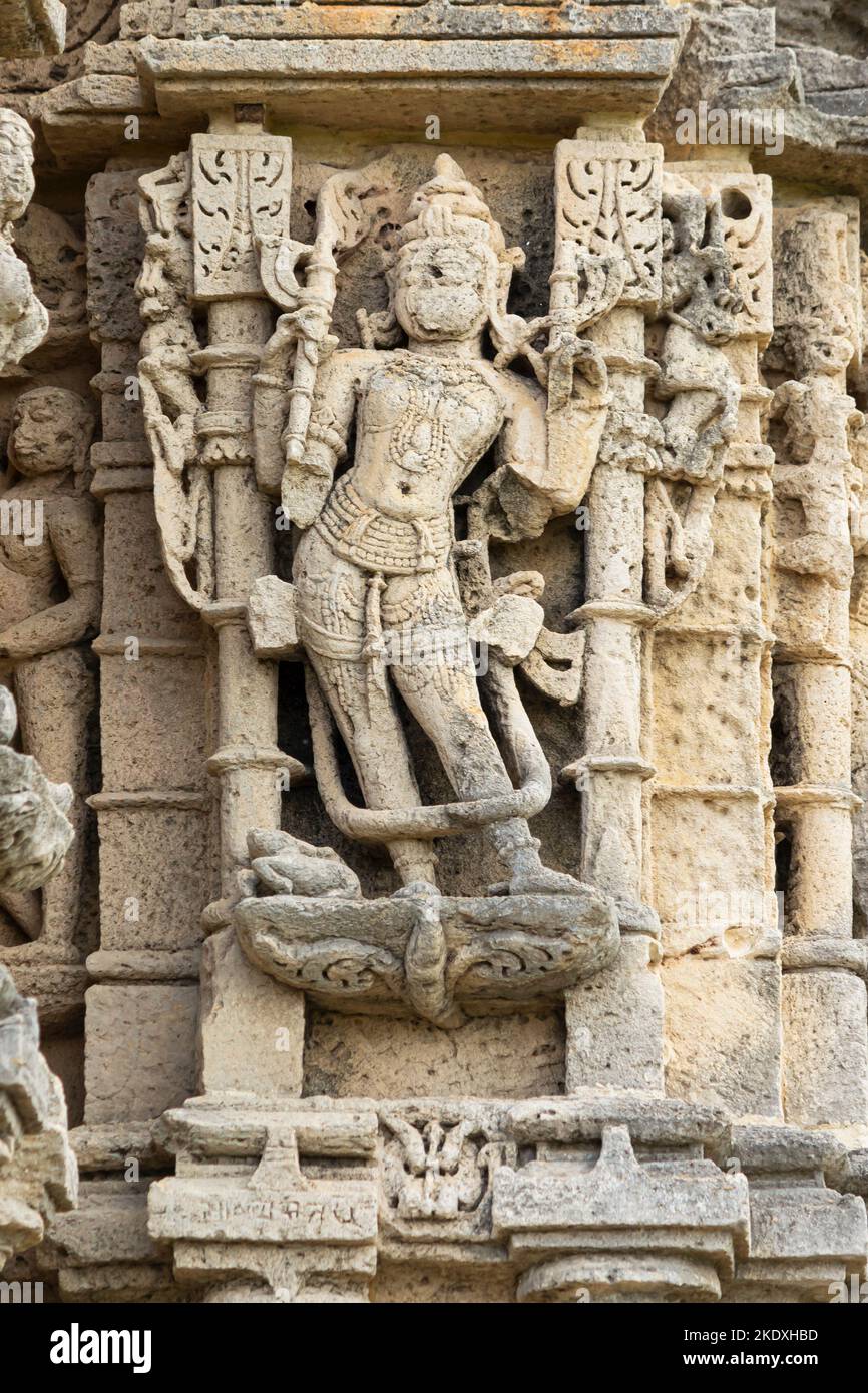 Broken Sculpture of Hindu God on Navlakha Temple, Ghumli, Dwarka, Gujarat, India. Stock Photo