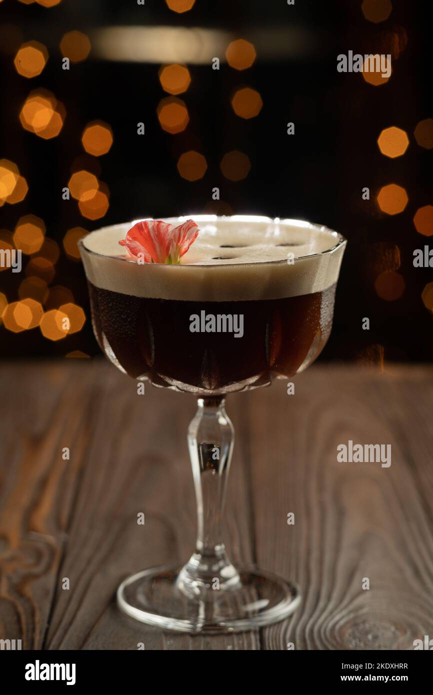 Espresso Martini cocktail in glass with coffee beans. Alcoholic coffee