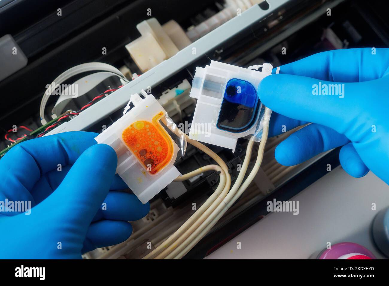 Repair of inkjet printer with continuous ink supply. Gloved master's