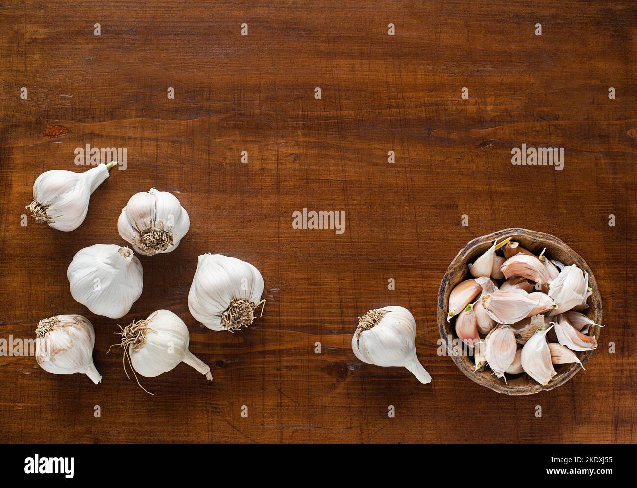 Garlic cloves on wooden vintage background Stock Photo - Alamy