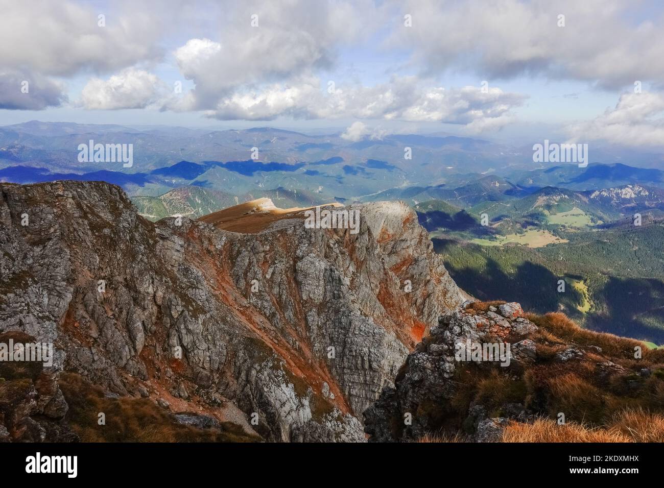 amazing wide view to other mountain landscape during hiking on the highest mountain of lower austria Stock Photo