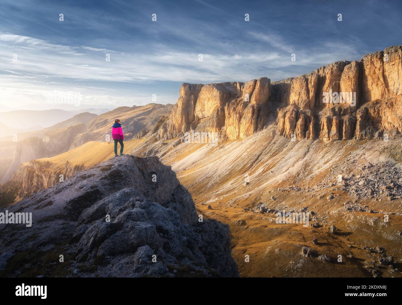 Sporty woman on the mountain peak and mountain canyon Stock Photo