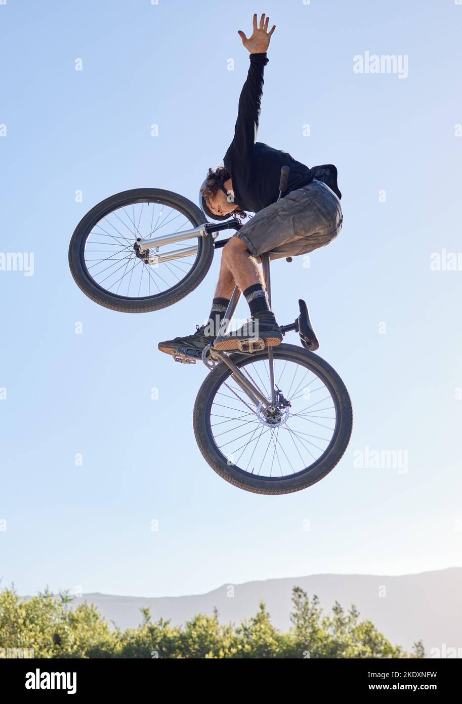 Bike jump, man and sport outdoor with biker and fitness, adrenaline and