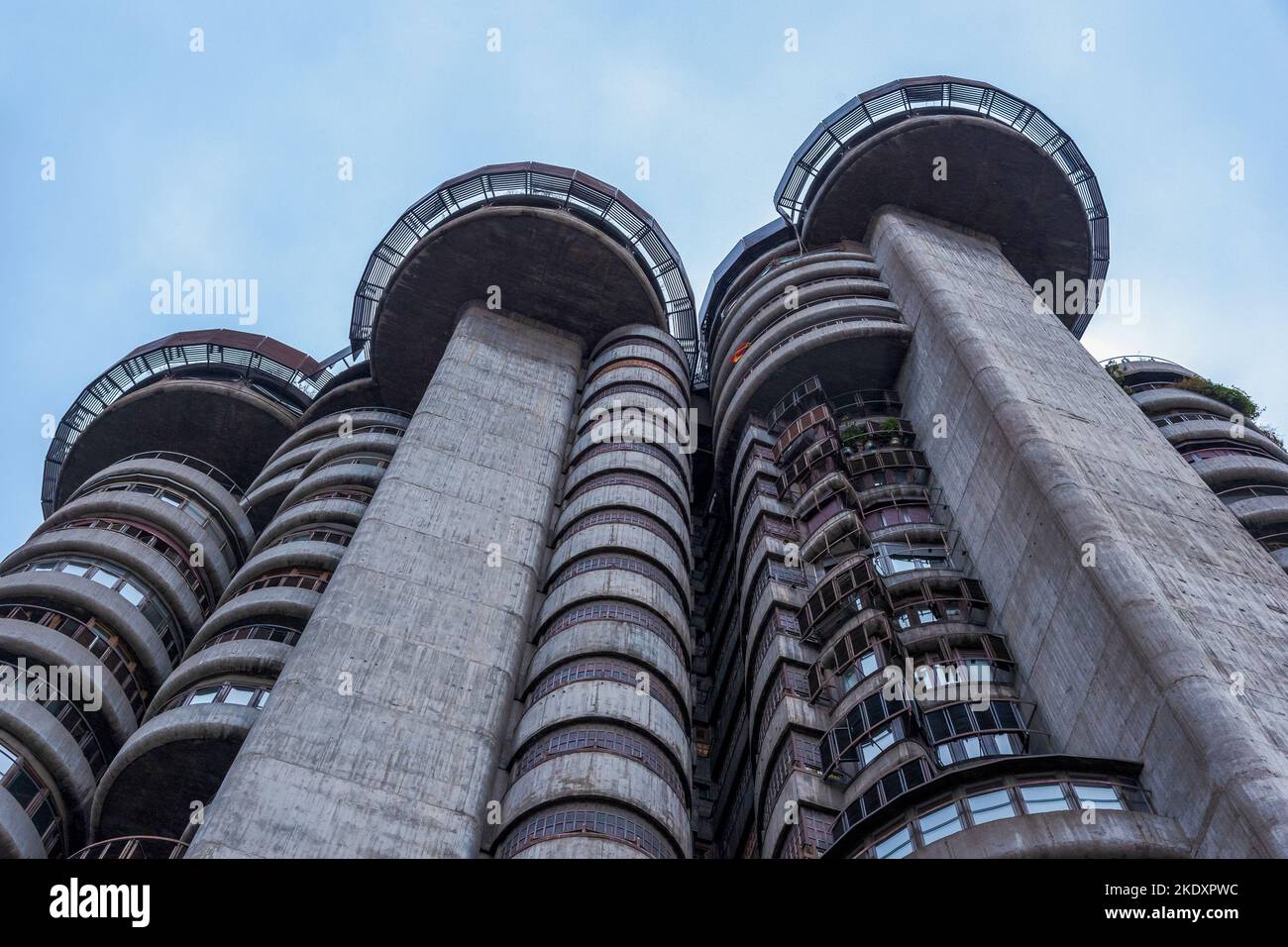 From below of modern building with round balconies in geometric walls ...