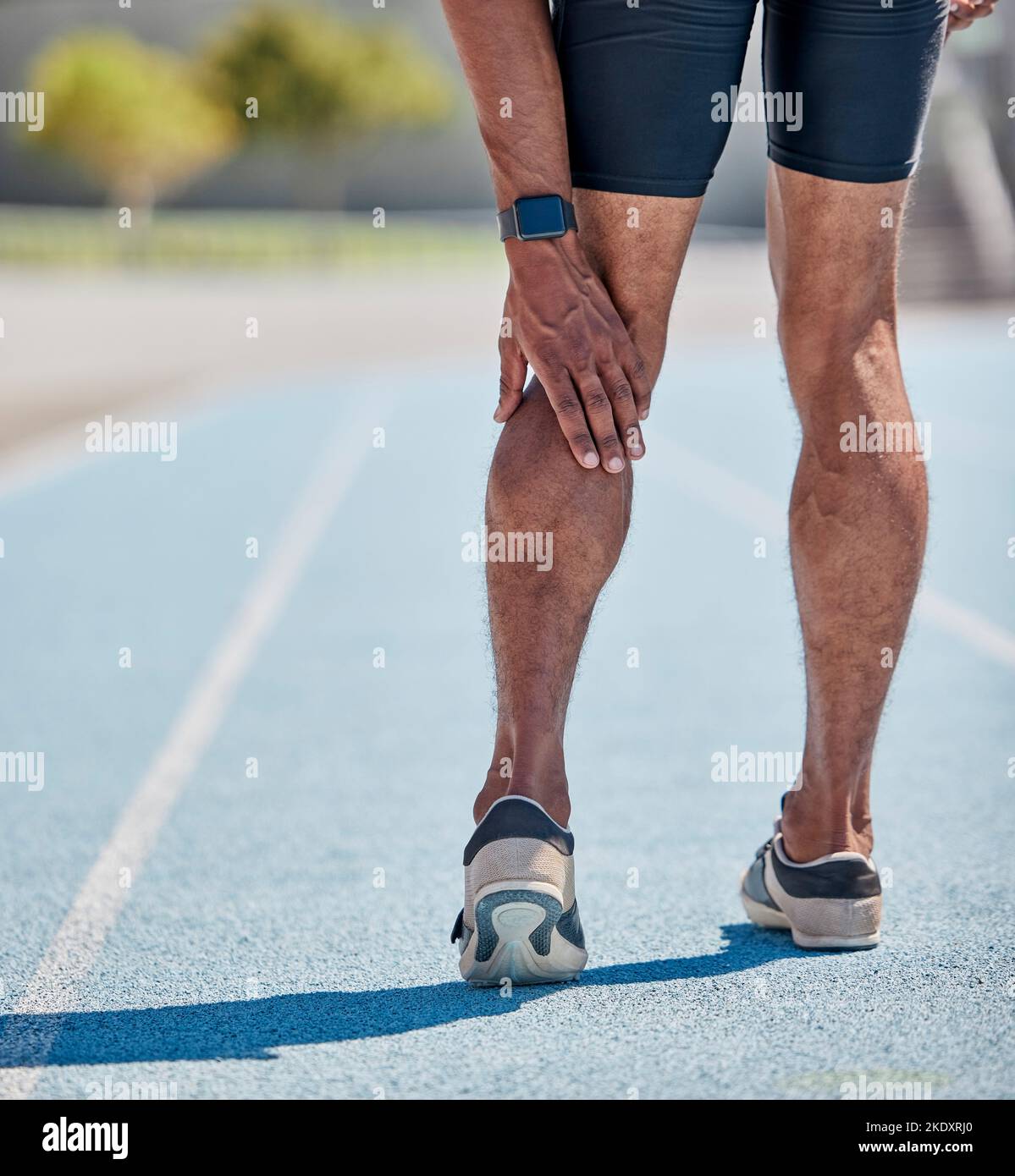 Legs injury for man running on track for cardio workout, sprint competition or marathon race. Muscle pain, calf problem and athlete runner with Stock Photo