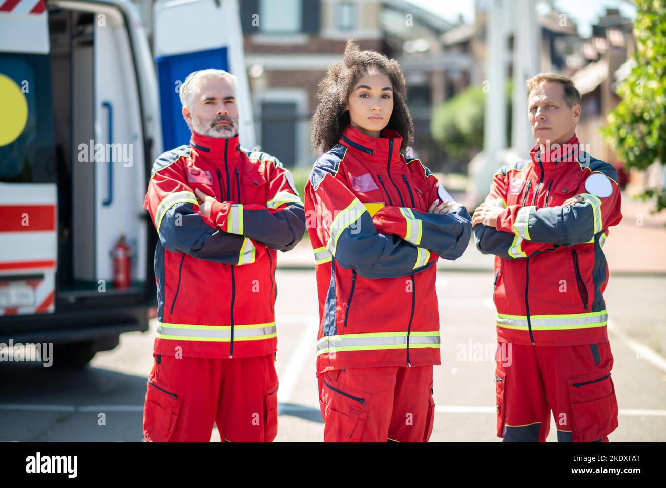 Ambulance doctors in uniforms near an EMS vehicle Stock Photo Alamy