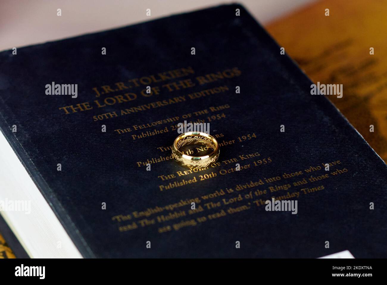 Astrakhan, Russia - 11.09.2022: Golden Ring of Power lies on the black thick The Lord of the Rings book Stock Photo