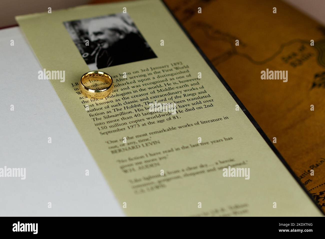Astrakhan, Russia - 11.09.2022: Golden Ring of Power lies on Tolkien's portrait in the The Lord of the Rings book Stock Photo