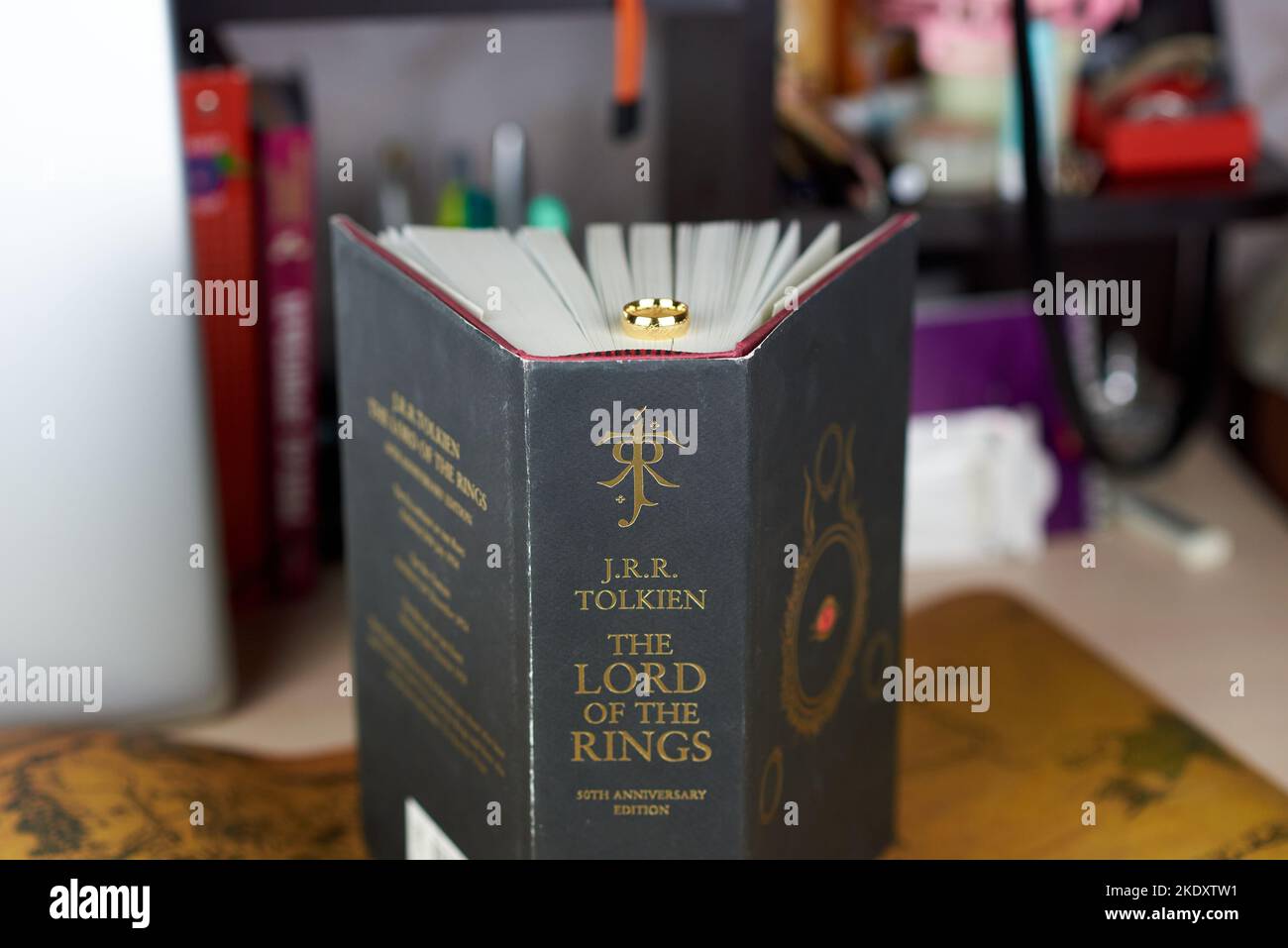 Astrakhan, Russia - 11.09.2022: Golden Ring of Power lies on the black thick The Lord of the Rings book Stock Photo