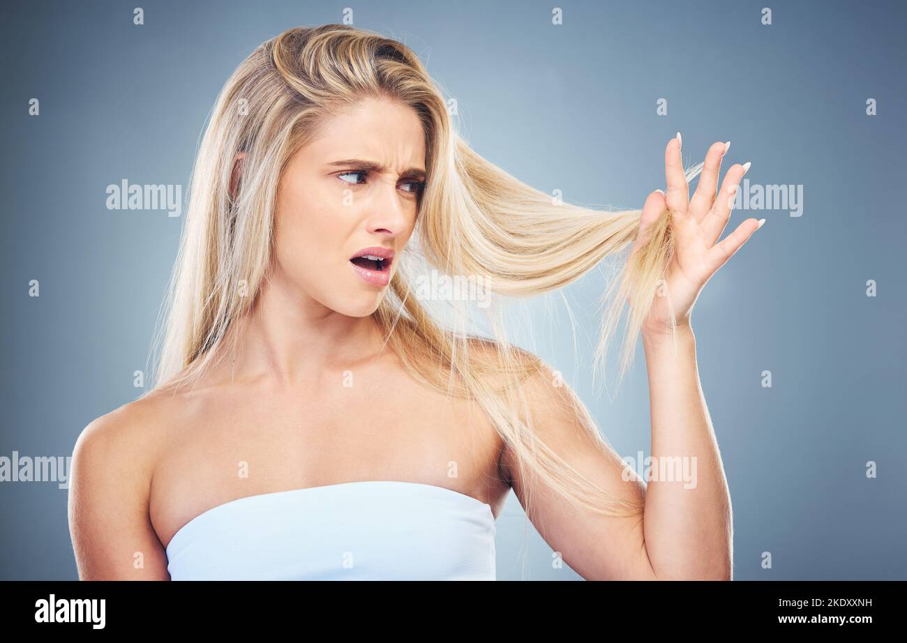 Hair care problem, angry and woman frustrated with damaged hair, split ends or bad haircut. Trichology crisis, hair disaster and model unhappy with Stock Photo