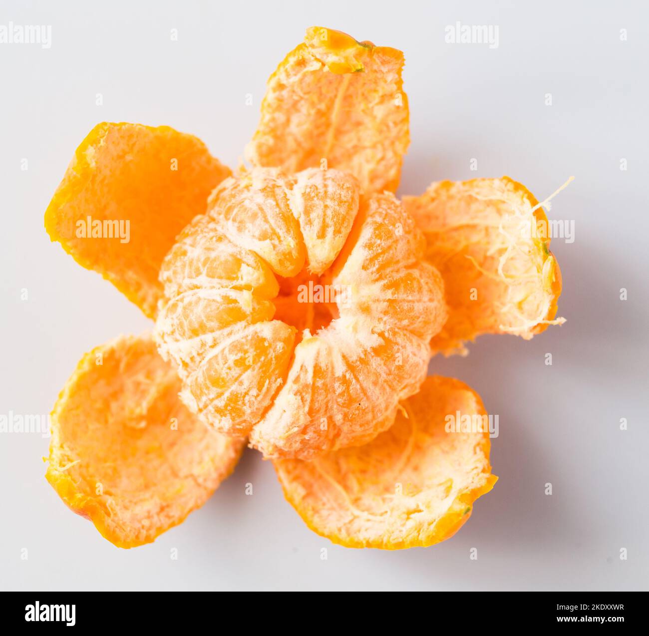 mandarin with peeled peel on white background Stock Photo Alamy