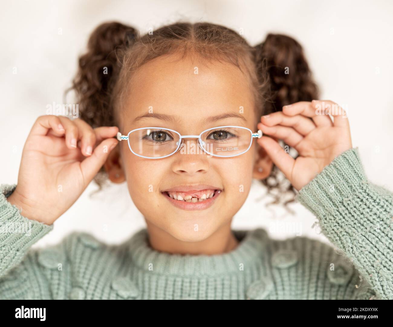 Child, glasses and eye care for vision, focus and eyesight of girl with