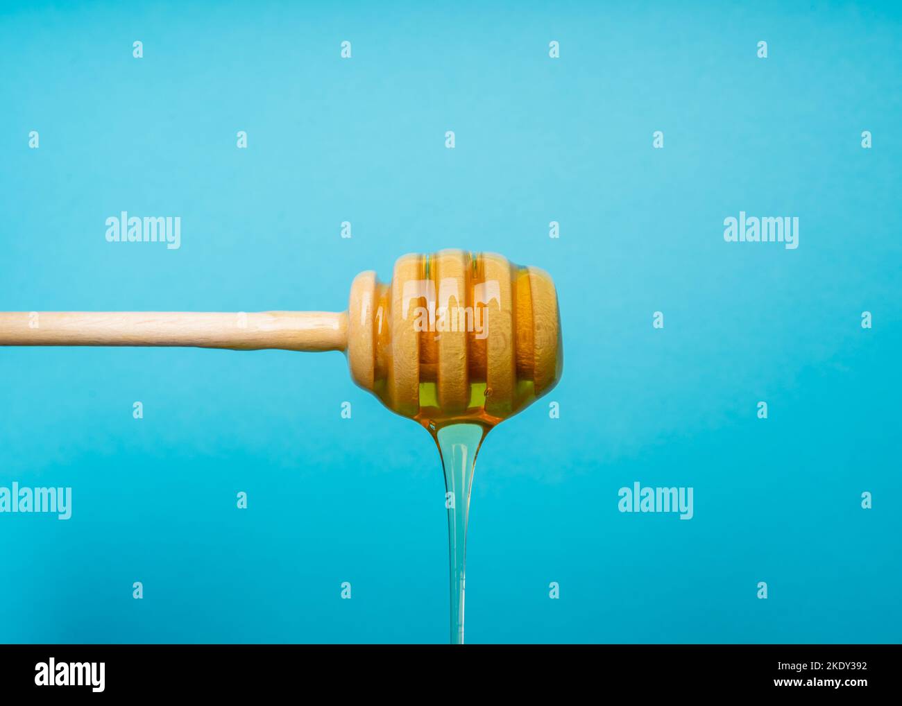 Clear Honey dripping from a honey dipper Stock Photo Alamy
