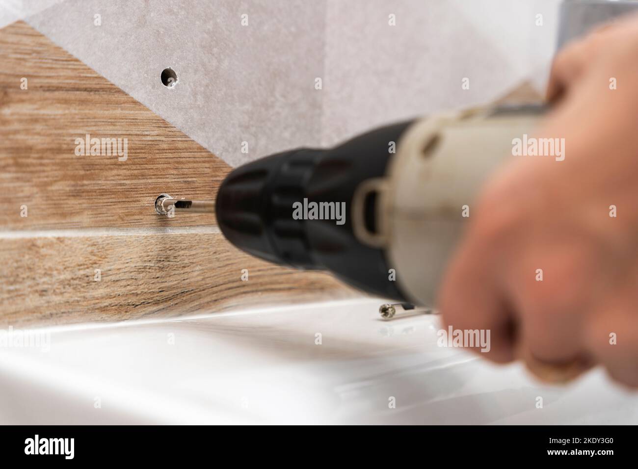 drilling holes in porcelain stoneware, drilling holes in tiles Stock Photo Alamy