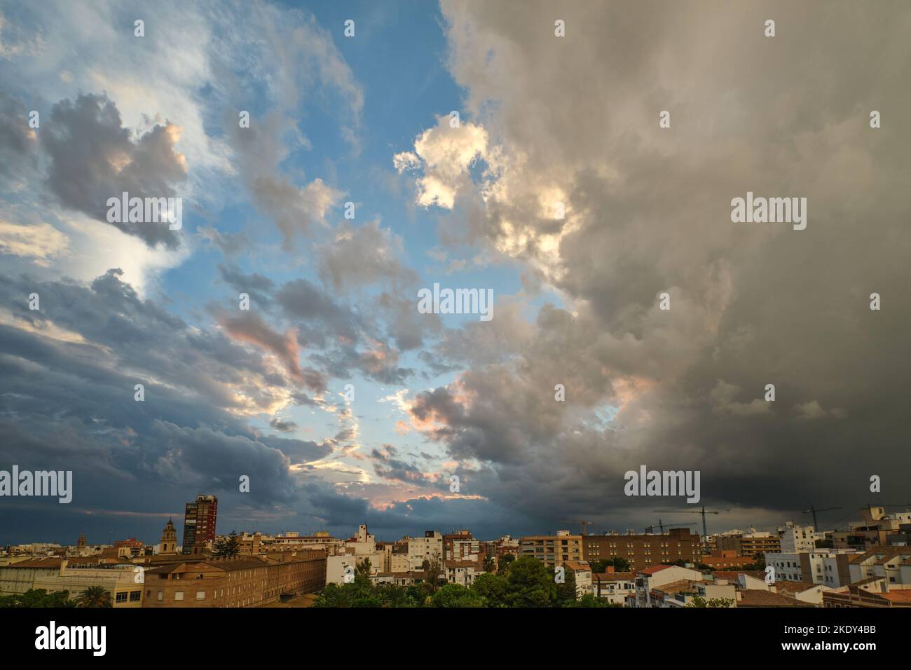 blue sky with clouds over the city Stock Photo - Alamy