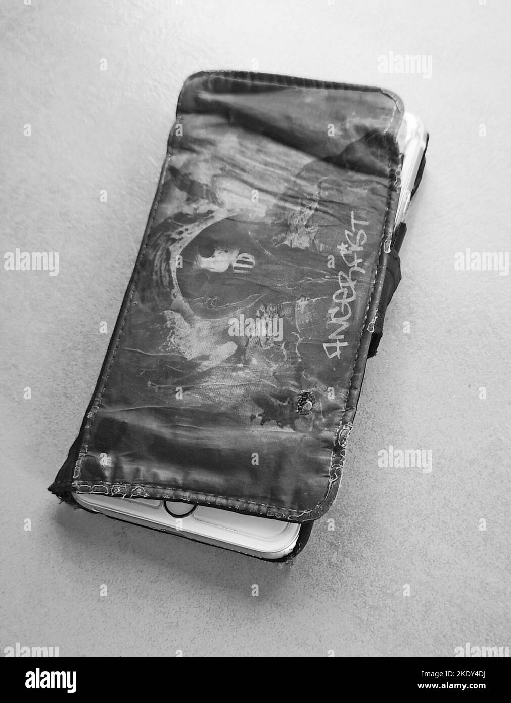 used Phone case, stark gebrauchte Handyhuelle schwarzweiss black and white Stock Photo