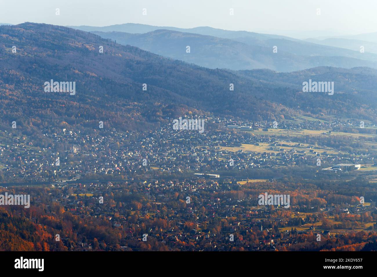 A beautiful view towards the Little Beskids and the village of Wilkowice from the observation tower on the Szyndzielnia mountain. Autumn morning. Pola Stock Photo