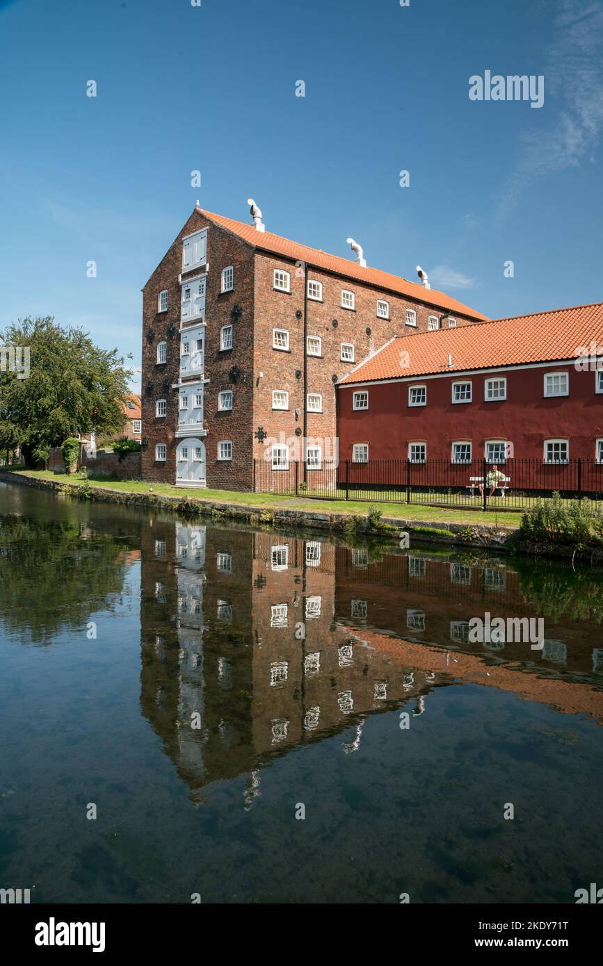 A vertical shot of the Victorian Warehouses on the Driffield Navigation Canal, Yorkshire Stock Photo