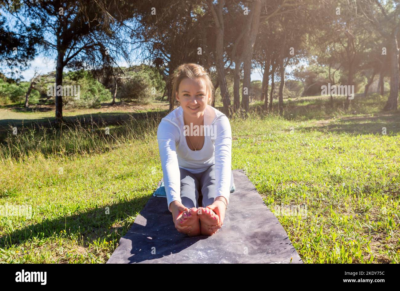 Woman stretching in woods hi-res stock photography and images - Alamy