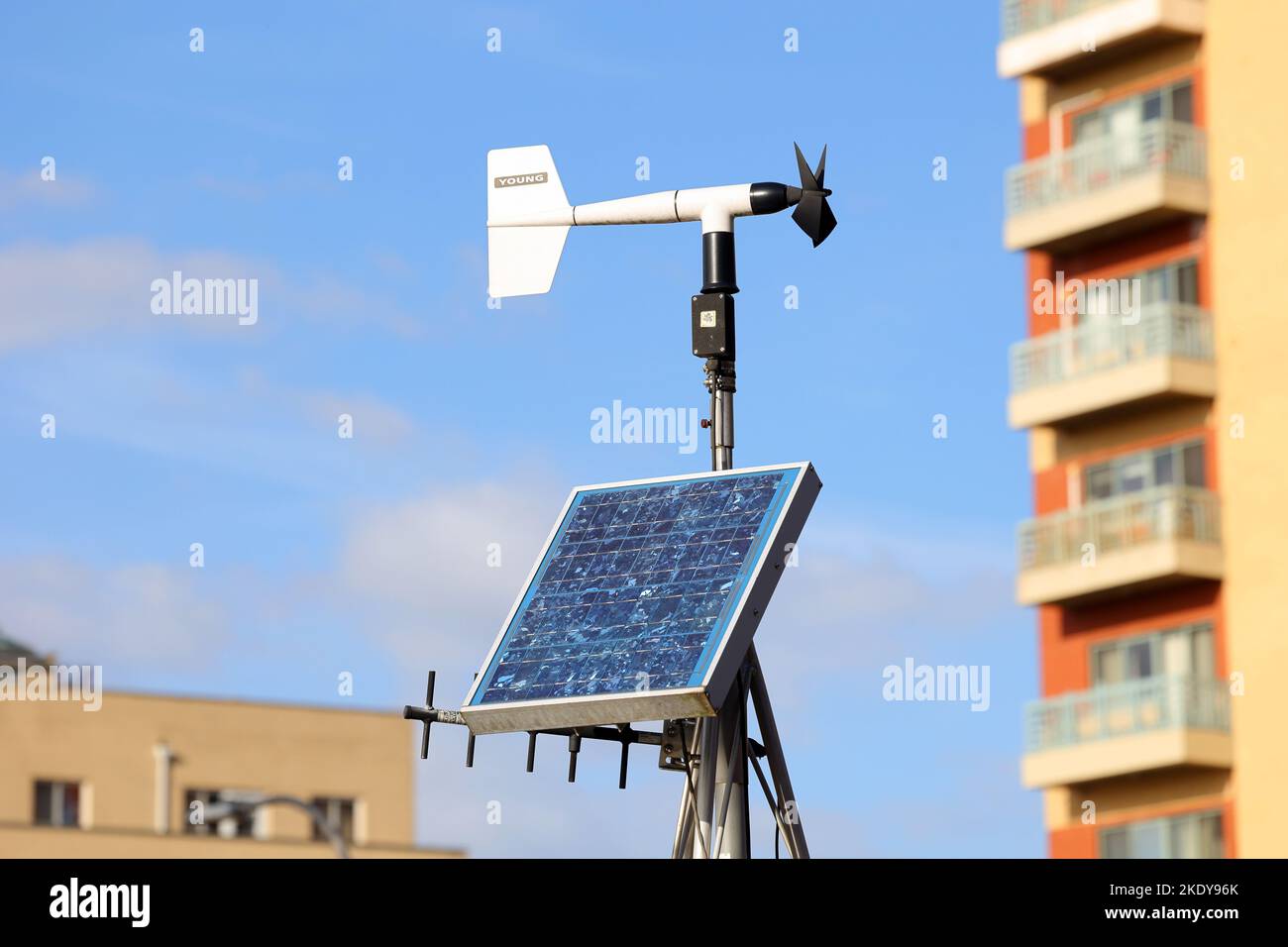 A solar powered weather station with a RM Young wind monitor sensor, and antenna. the wind monitor is a wind-mill-style anemometer. Stock Photo