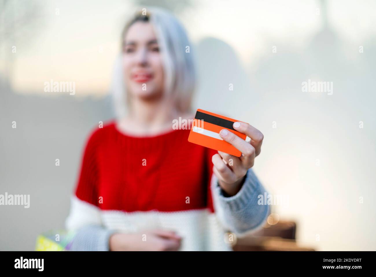 Smiling Young Woman Standing In A Shopping Center Stock Photo - Alamy