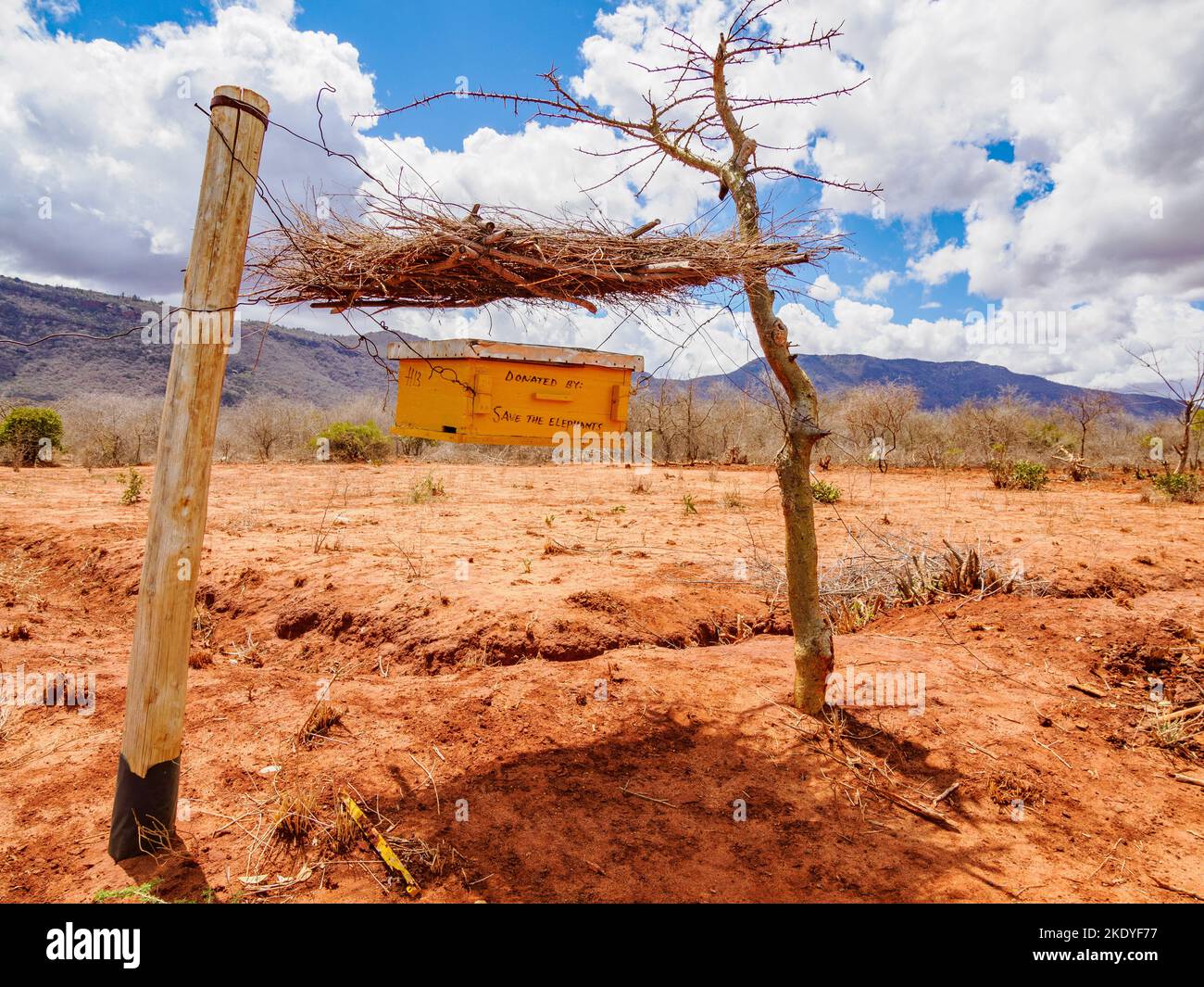 A  beehive fence designed to deter elephants from raiding crops in the Sagalla region of Kenya Stock Photo