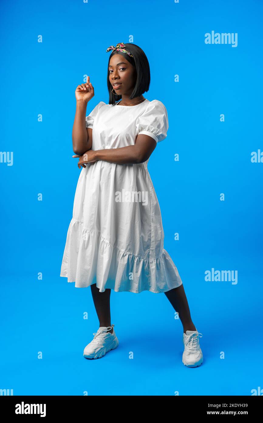 Full length portrait of a beautiful young african woman posing in ...