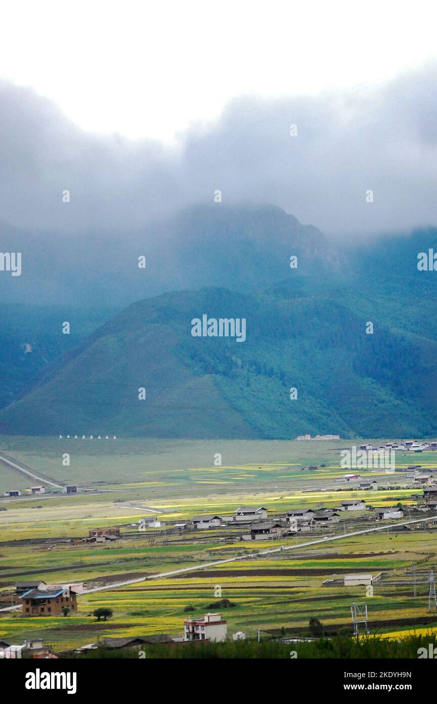 A beautiful landscape of a village with houses and mountains in a ...