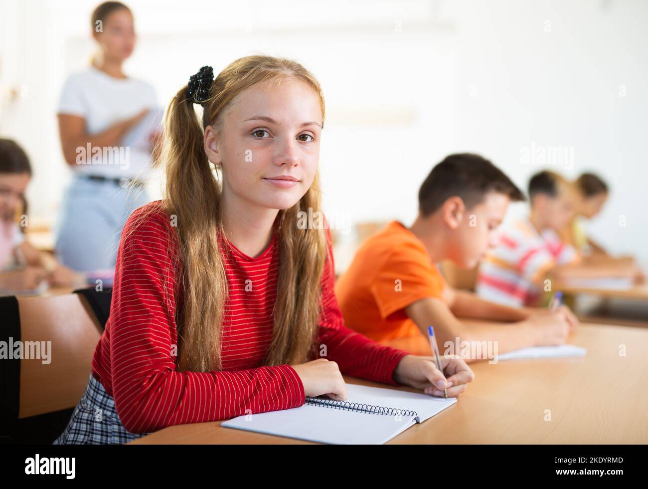 Portrait of girl in classroom during lesson Stock Photo - Alamy