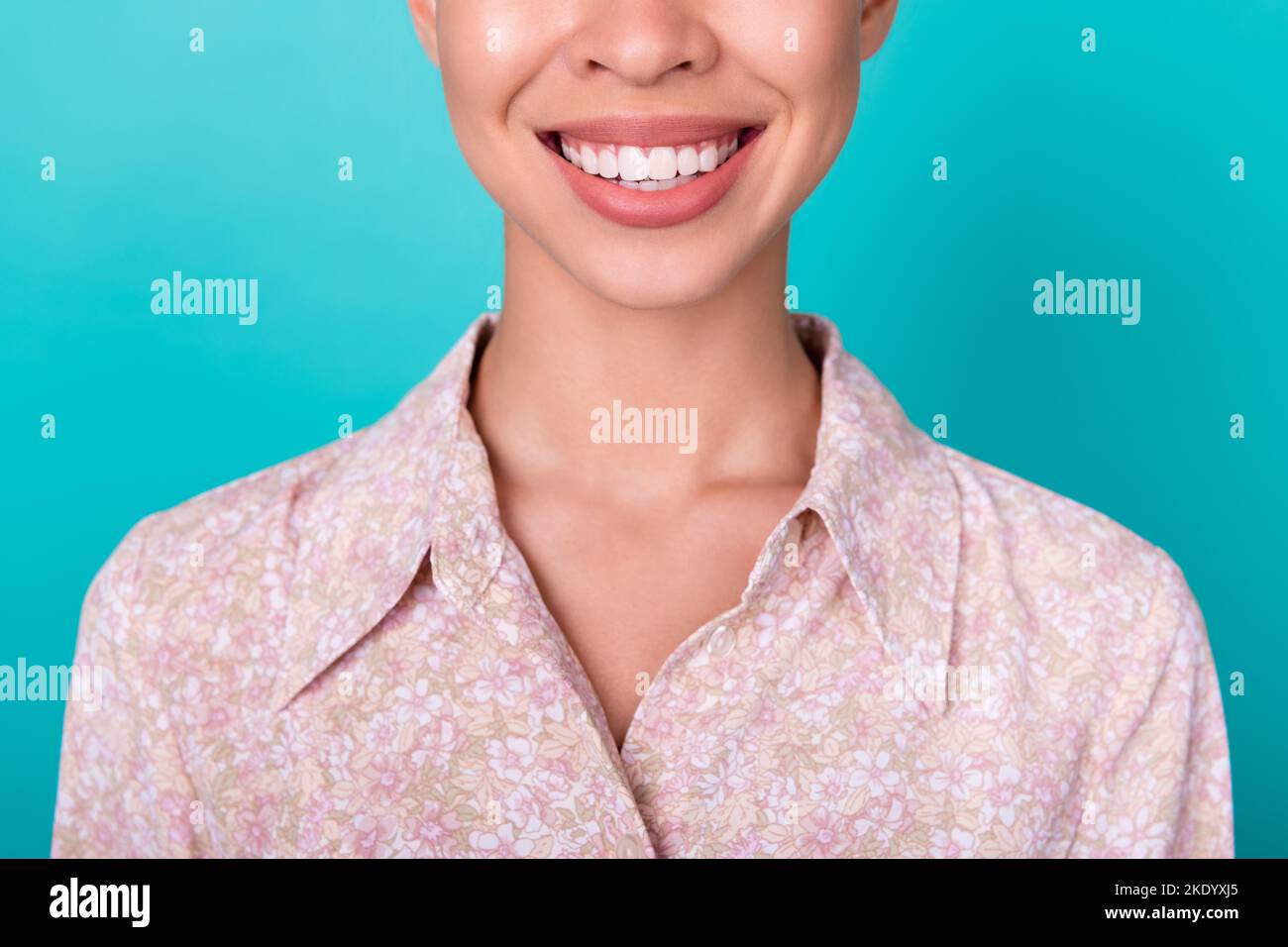 Cropped close up portrait of positive lady toothy beaming smile isolated on turquoise color background Stock Photo