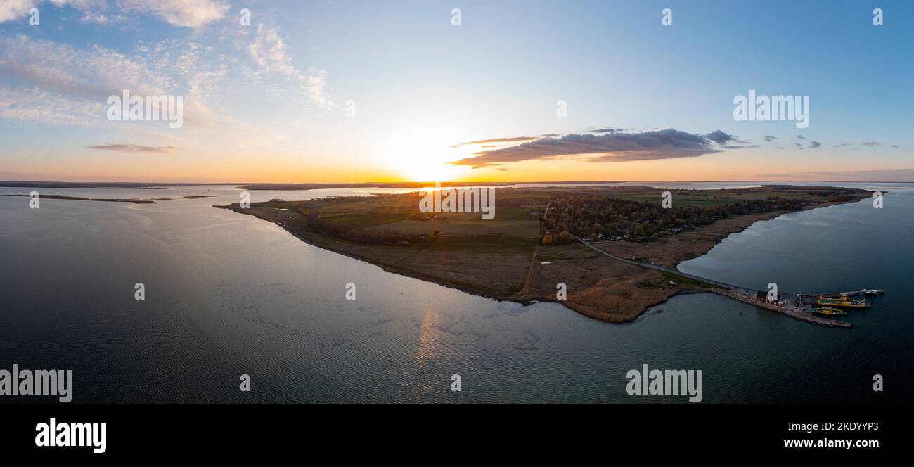 An aerial view of an island covered with green grass and trees, in the ...