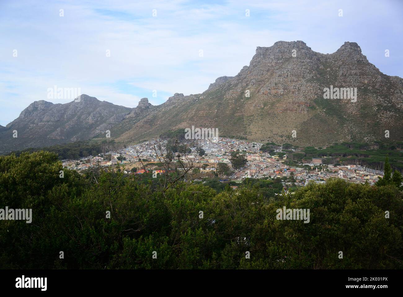 The Imizamo Yethu cityscape from afar with high mountains in the ...