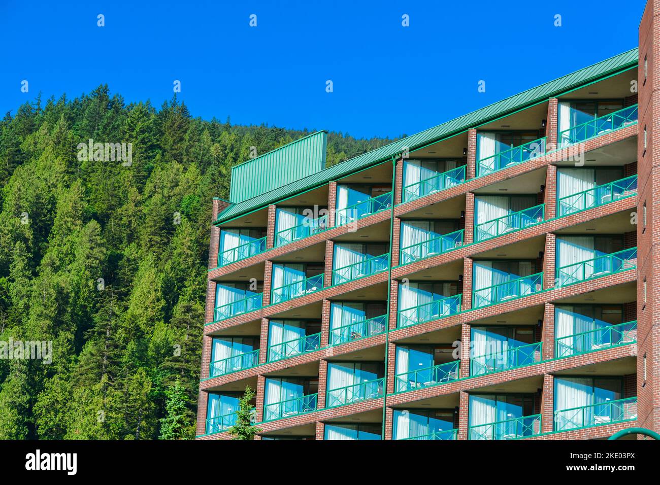 Resort building facade on mounting and blue sky background Stock Photo