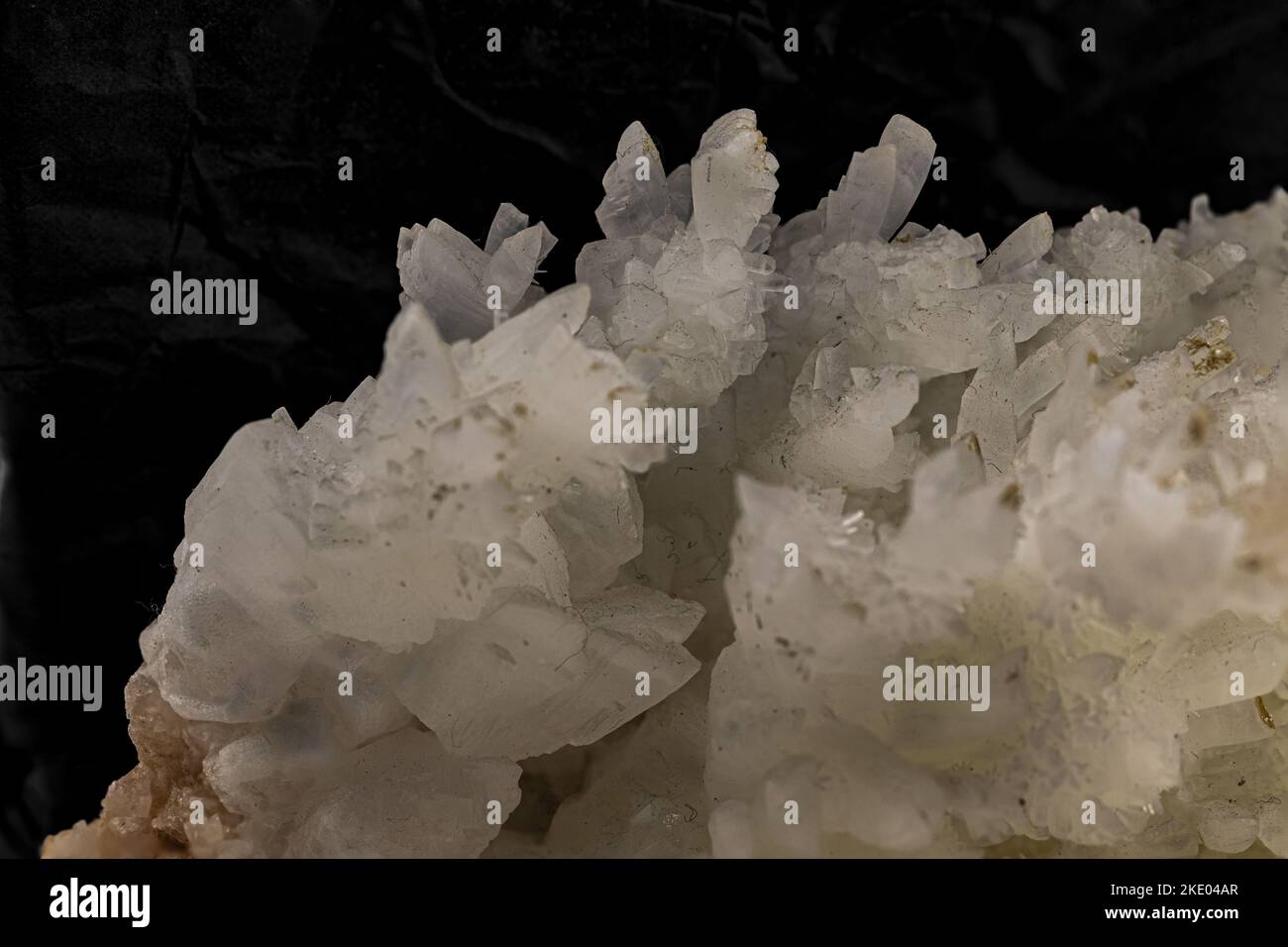 Crystals of calcite mineral sample on black Stock Photo