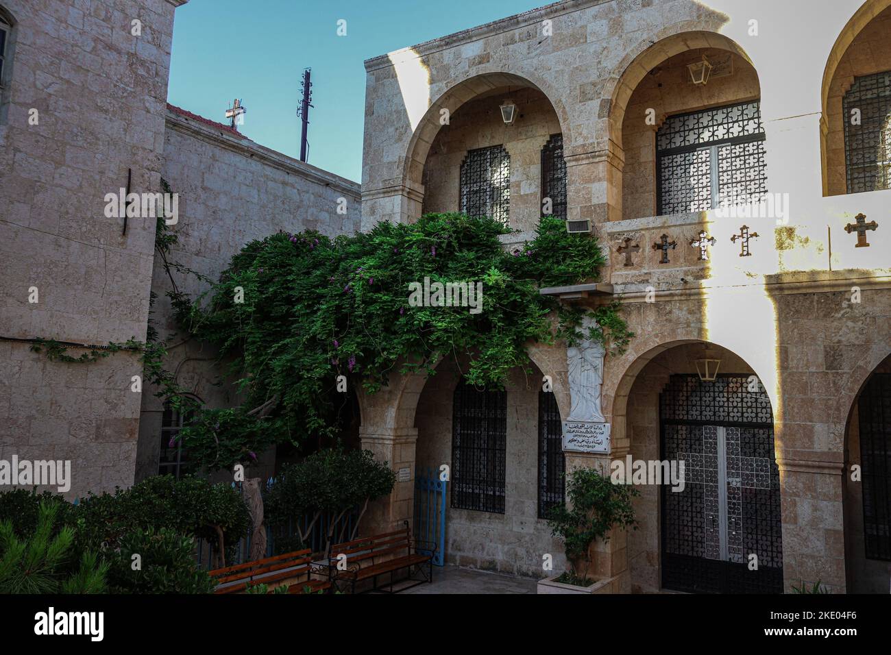 The exterior of the Convent of Our Lady monastery with greenery in ...