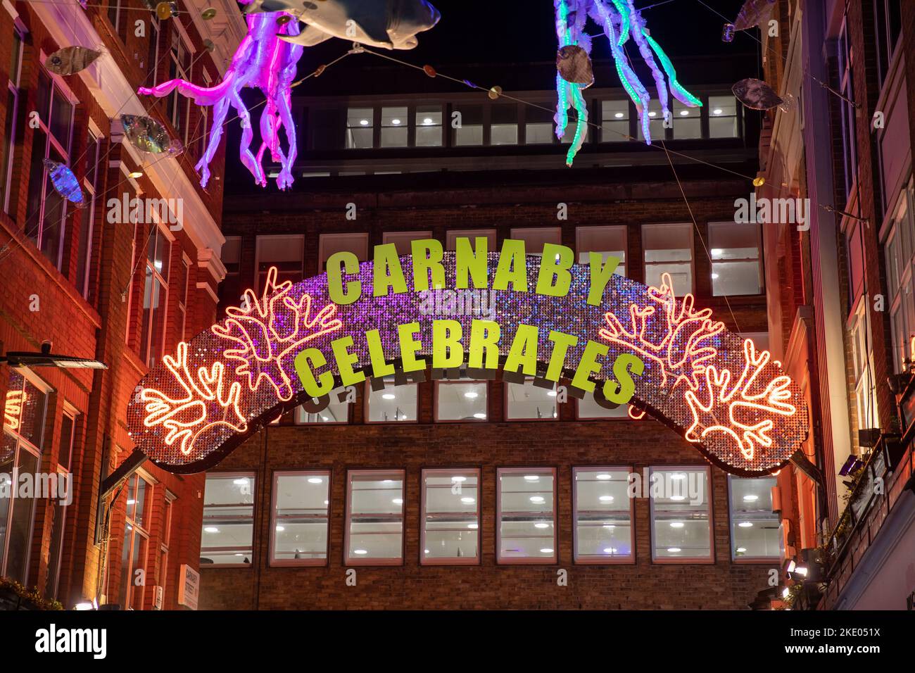 Carnaby Street's Christmas Lights installation 'Carnaby Celebrates' is switched on in Soho, London on 8th November 2022, the celebrates 25 years of the seasonal display. Stock Photo