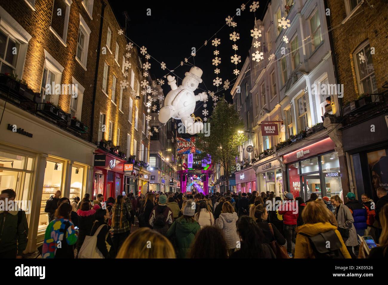 Carnaby Street's Christmas Lights installation 'Carnaby Celebrates' is switched on in Soho, London on 8th November 2022, the celebrates 25 years of the seasonal display. Stock Photo