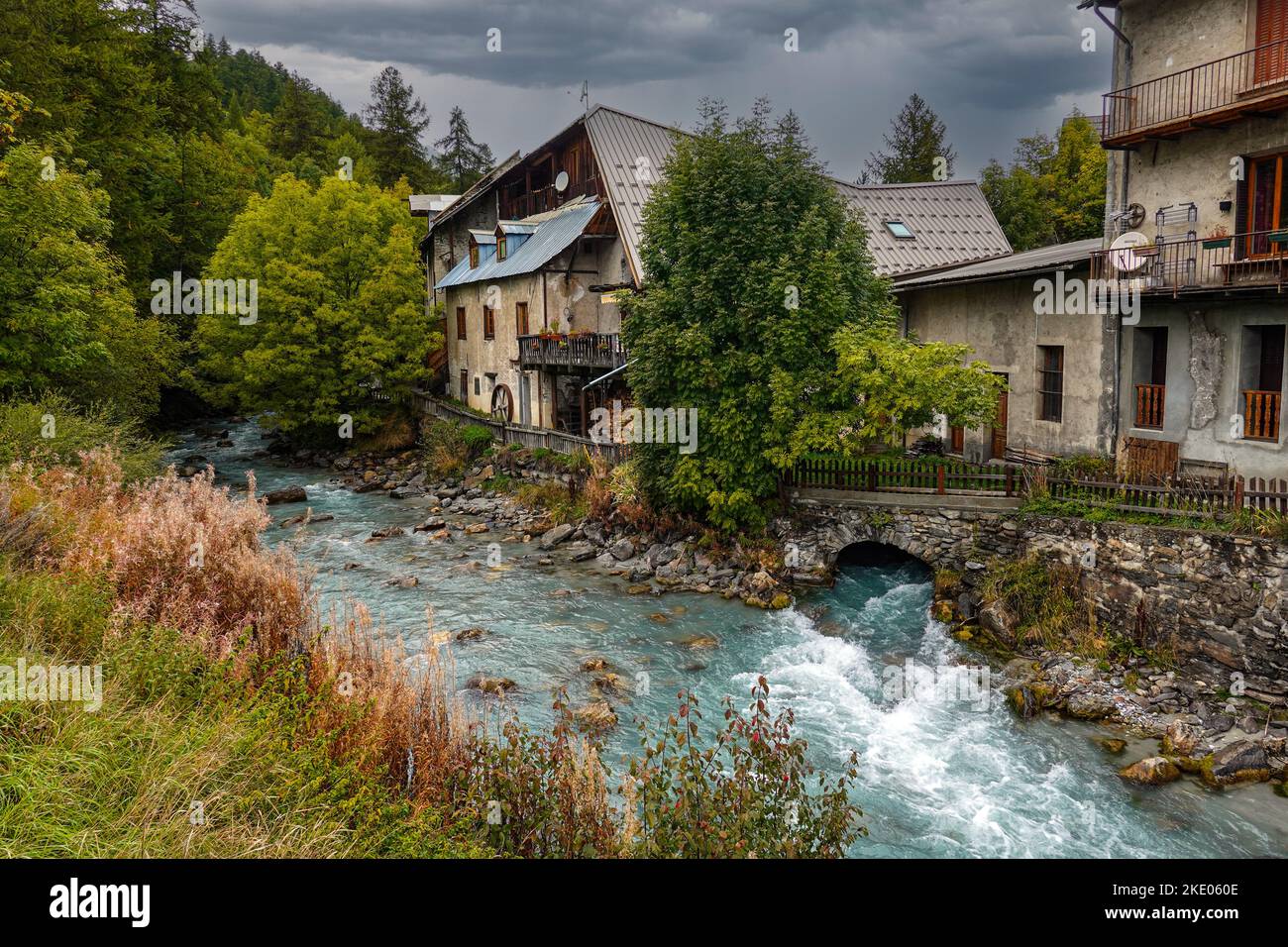Old mill by river, Autumn colours in Ecrins National Park, the Alps, Briancon, France, EU Stock Photo
