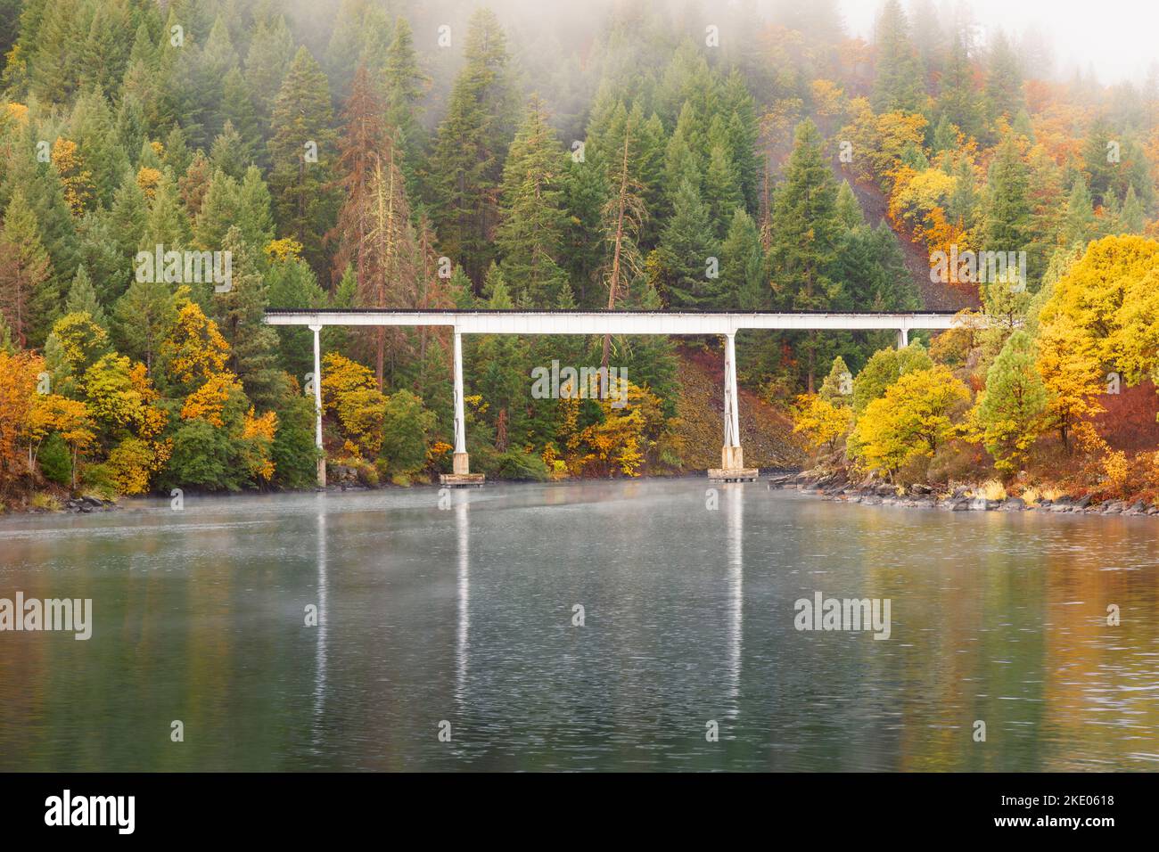 Rail trestle used in the movie Stand By Me over lake Britton in Shasta County, California, USA photographed in autumn with low clouds/fog. Stock Photo
