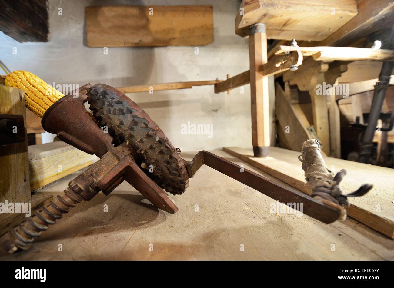 Austria, device with a hand crank for shredding corn on the cob for processing in the flour mill in the so-called Strutz-Mill, an old water mill in St Stock Photo