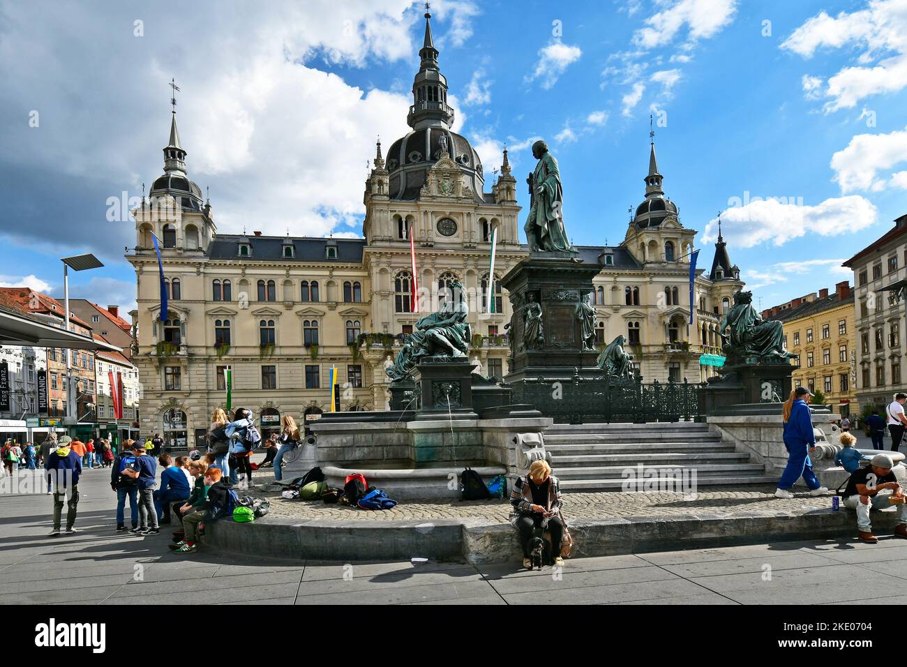 Graz, Austria - September 22, 2022: Unidentified people on main square with Archduke Johann fountain and town hall in the background Stock Photo