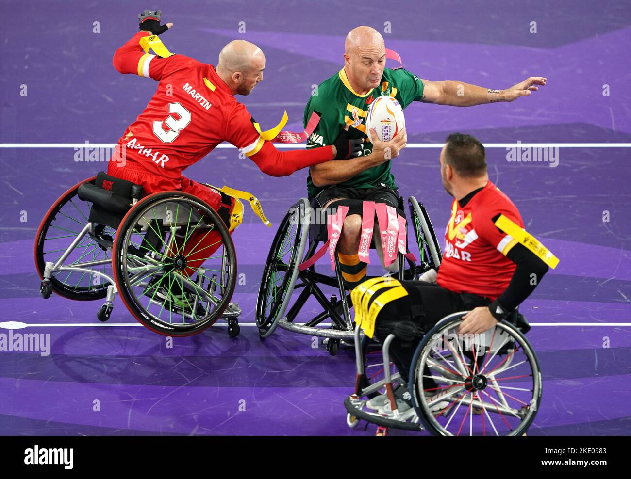 Australia's Peter Arbuckle is tackled by Spain's Yannick Martin during the Wheelchair Rugby League World Cup group A match at the Copper Box Arena, London. Picture date: Wednesday November 9, 2022. Stock Photo