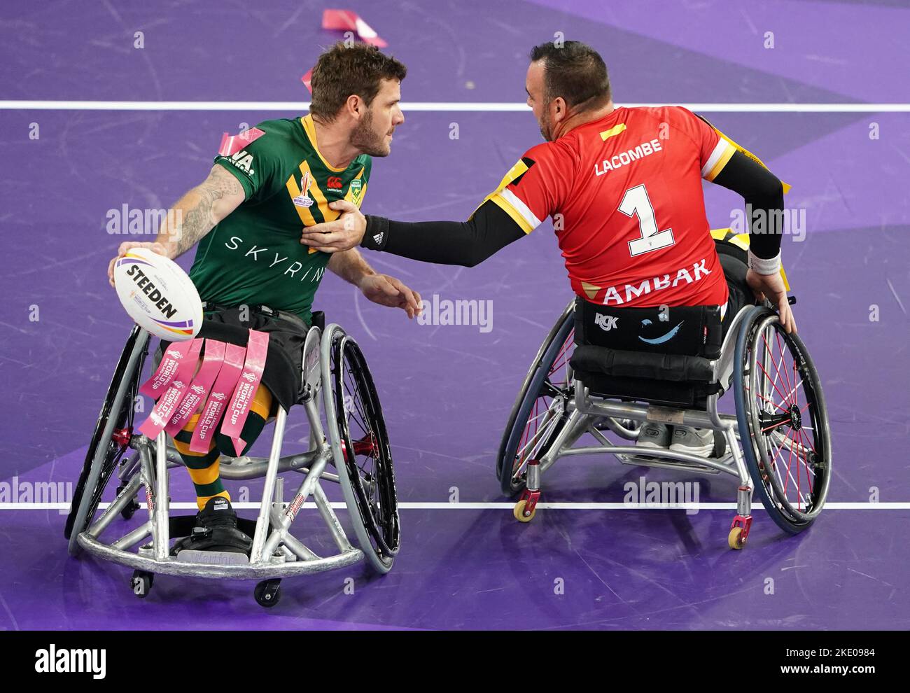 Australia's Adam Tannock is tackled by Spain's Joel Lacombe during the Wheelchair Rugby League World Cup group A match at the Copper Box Arena, London. Picture date: Wednesday November 9, 2022. Stock Photo
