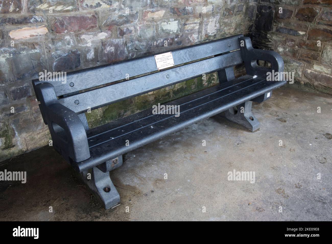 A plaswood weatherproof memorial bench seat made from used agriculutural plastic waste on promenade Ilfracombe Devon Stock Photo